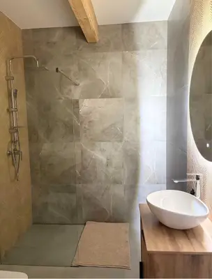 a bathroom with a sink and a glass shower at Zawojenka in Zawoja