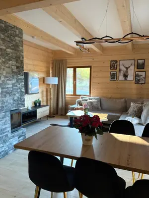 a living room with a table and a couch at Zawojenka in Zawoja