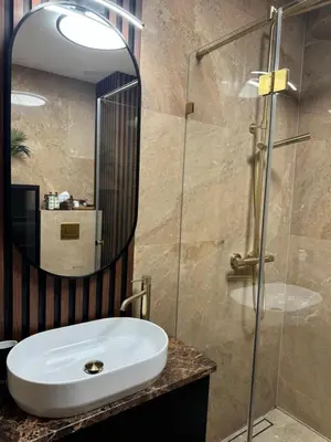 a bathroom with a sink and a mirror at Apartament KRAKÓW CENTRUM Smoleńsk 33 in Kraków