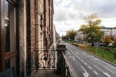 a view of a street from a balcony of a building at Native Apartments Krasińskiego 21 in Kraków