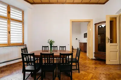 a dining room with a table and chairs at Native Apartments Krasińskiego 21 in Kraków