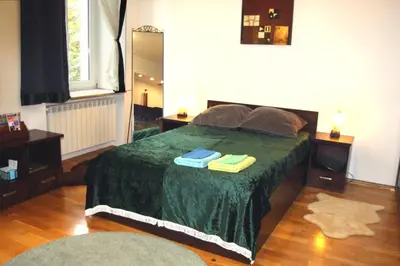 a bedroom with a bed with two towels on it at Bona Studio, City Center, WiFi in Kraków