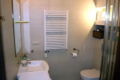 a small bathroom with a sink and a toilet at Bona Studio, City Center, WiFi in Kraków
