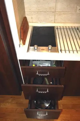 a room with a bed with two drawers at Bona Studio, City Center, WiFi in Kraków