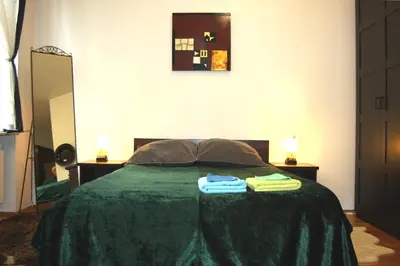 a bedroom with a bed with two towels on it at Bona Studio, City Center, WiFi in Kraków