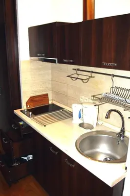 a kitchen with a sink and a counter top at Bona Studio, City Center, WiFi in Kraków