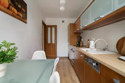two bottles of essential oils sitting on a shelf at Malila Premium Apartments Brodowicza 5 in Kraków