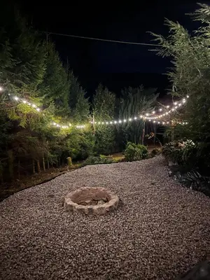 a garden at night with a bunch of lights at Świerkowa Chata in Targanice
