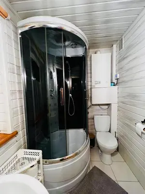 a bathroom with a shower and a toilet at Świerkowa Chata in Targanice