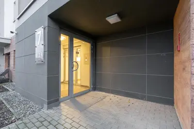 an entrance to a building with a glass door at Dębniki Comfort Studio by BookingHost in Kraków
