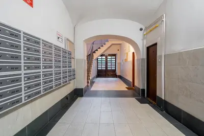 a hallway in a building with an archway at Bocheńska Modern Apartment by BookingHost in Kraków