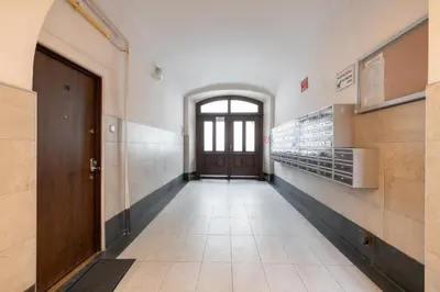 an empty hallway with a door in a building at Bocheńska Modern Apartment by BookingHost in Kraków