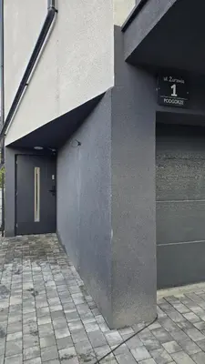 a building with a door on the side of it at Apartamenty Żurawia 1 - Piętro 1 in Kraków