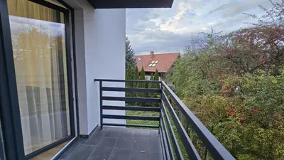 a balcony with a view of a house at Apartamenty Żurawia 1 - Piętro 1 in Kraków