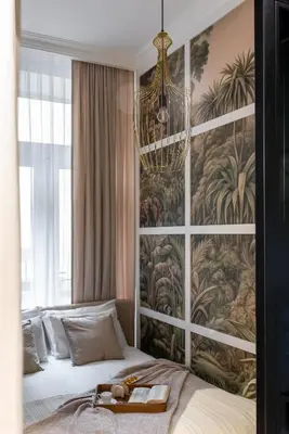 a bedroom with a bed with a large wall mural at Colora Apartments by MB Apartments in Kraków