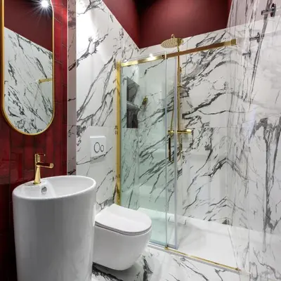 a bathroom with a shower and a toilet and a sink at Colora Apartments by MB Apartments in Kraków