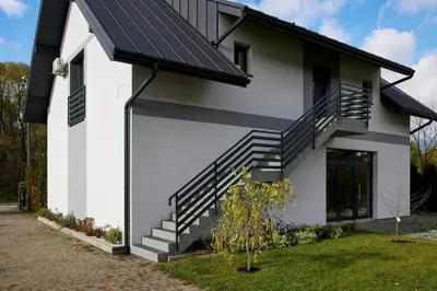 a house with solar panels on the side of it at Przytulne M w Pcimiu in Pcim