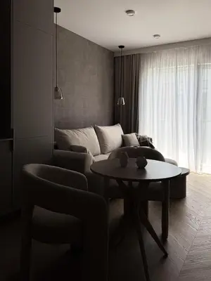 a living room with a couch and a table at O2 Premium Residence in Kraków