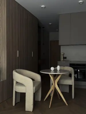 a dining room with a table and two chairs at O2 Premium Residence in Kraków