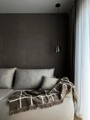 a bed with a blanket on top of it at O2 Premium Residence in Kraków