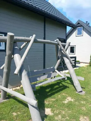a wooden fence in front of a house at Sister's House Zator in Palczowice