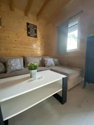 a living room with a couch and a table at Sister's House Zator in Palczowice