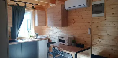a kitchen with a table with a microwave on it at Sister's House Zator in Palczowice