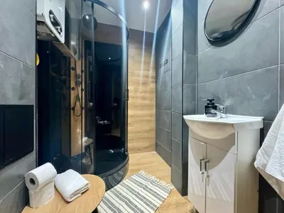 a bathroom with a shower and a sink at Apartament Bałandy 18 in Oświęcim