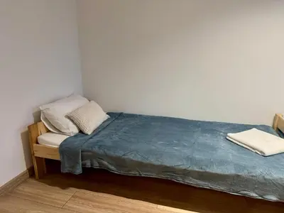 a bed with two pillows on it in a room at Apartament Bałandy 18 in Oświęcim