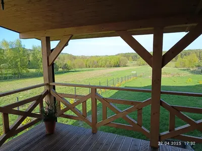 a porch with a view of a field at Jura - Chata pod Grodziskiem Pańskim in Domaniewice