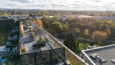 an aerial view of a city with trees and buildings at Imperial Capital Apartments by BookingHost in Kraków