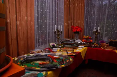a table with many plates of food on it at Zajazd Zagłoba in Widoma