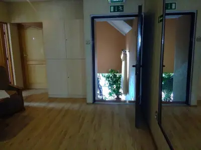 a hallway with an open door to a room at Zajazd Zagłoba in Widoma