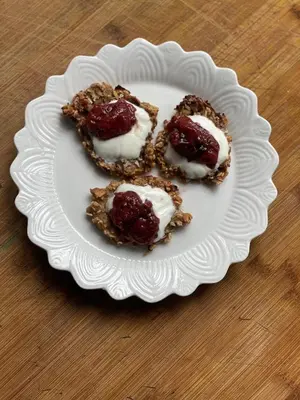 three desserts on a white plate on a table at Villatopol Art Hostel in Rząska