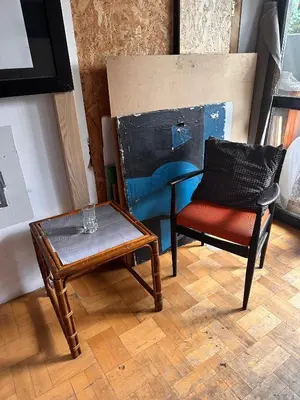 a living room with a chair and a table at Villatopol Art Hostel in Rząska