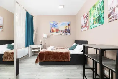 a hotel room with two beds and a table at Zyblikiewicza 11 by Homeprime in Kraków