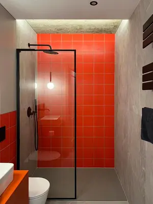 a bathroom with red tile and a shower at Green Point - Design Apartaments in Kraków