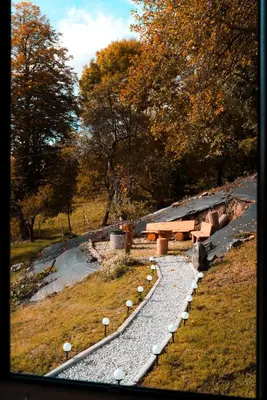 a park with a picnic table and a pond at Zachód Beskidu domek z Jacuzzi na wyłączność in Nowe Rybie