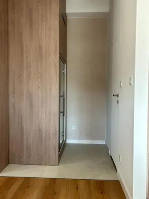 an empty hallway with wooden walls and a door at Cracow Center Jacuzzi & Sauna Penthouse Retreat in Kraków