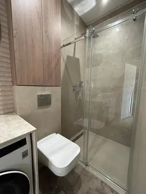 a bathroom with a shower and a toilet and a sink at Cracow Center Jacuzzi & Sauna Penthouse Retreat in Kraków