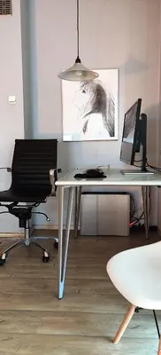 an office with a desk with a computer and a chair at Cozy Studio for a Couple - 10 min from the airport in Kraków