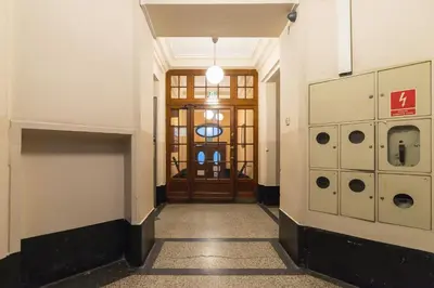 an empty hallway with a door in a building at Comfy Apartment Lubelska Krakow by Noclegi Renters in Kraków