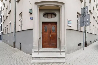 a wooden door on the side of a building at Comfy Apartment Lubelska Krakow by Noclegi Renters in Kraków