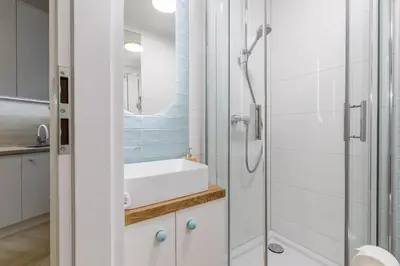 a bathroom with a shower and a sink at Cracow S31 in Kraków