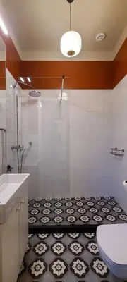 a bathroom with a shower and a sink and a toilet at Stylish apartment in trendiest area in Kraków