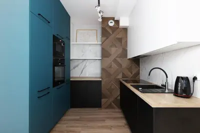 a kitchen with blue cabinets and a sink at Prandoty 10B by Homeprime in Kraków