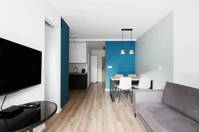 a living room with a couch and a table at Prandoty 10B by Homeprime in Kraków