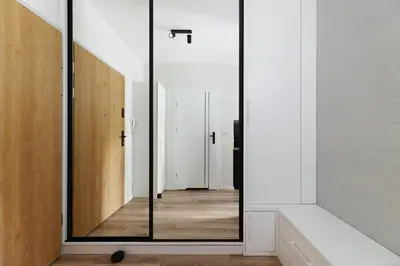 a glass door in a room with a hallway at Prandoty 10B by Homeprime in Kraków