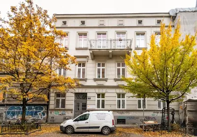 a white van parked in front of a building at Malila Premium Apartments Cracow Sebastiana 17 Old Town in Kraków