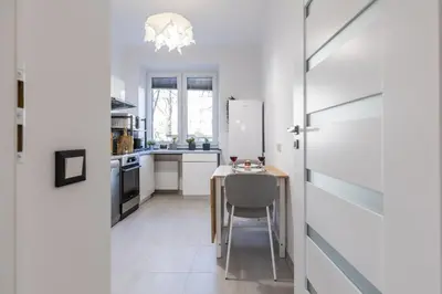 a living room with a table and chairs at 3 Rooms Comfort Capybara Apartment Free Parking by CityBeat in Kraków